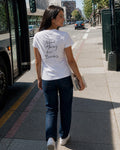 Need Money for Books – Classic T-Shirt in White – authentisches iPhone-Lifestylebild